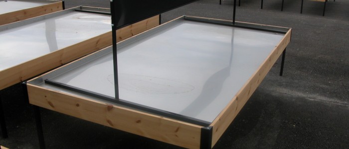 custom retail display table with raised edges